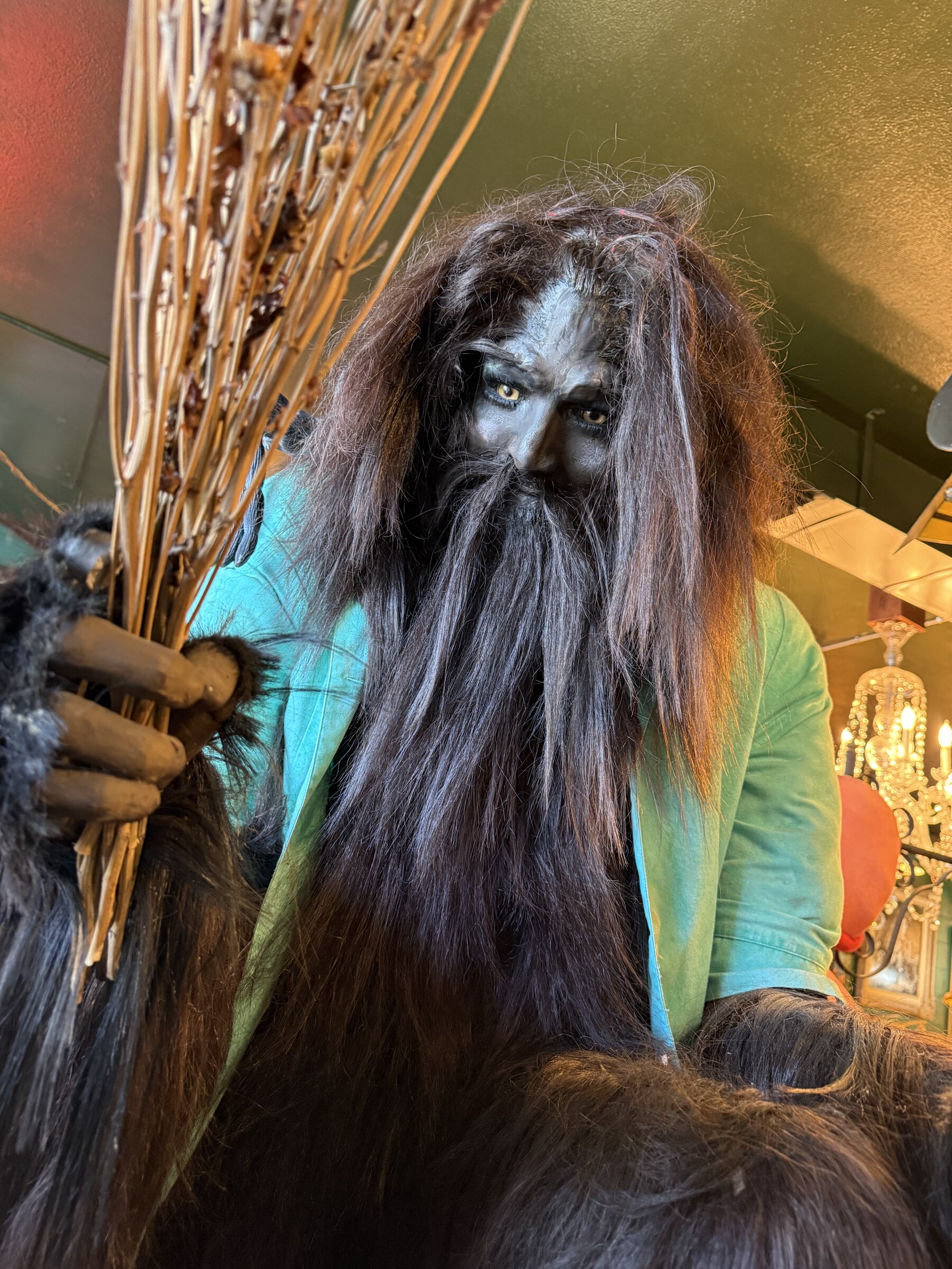 A mossy bearded figure