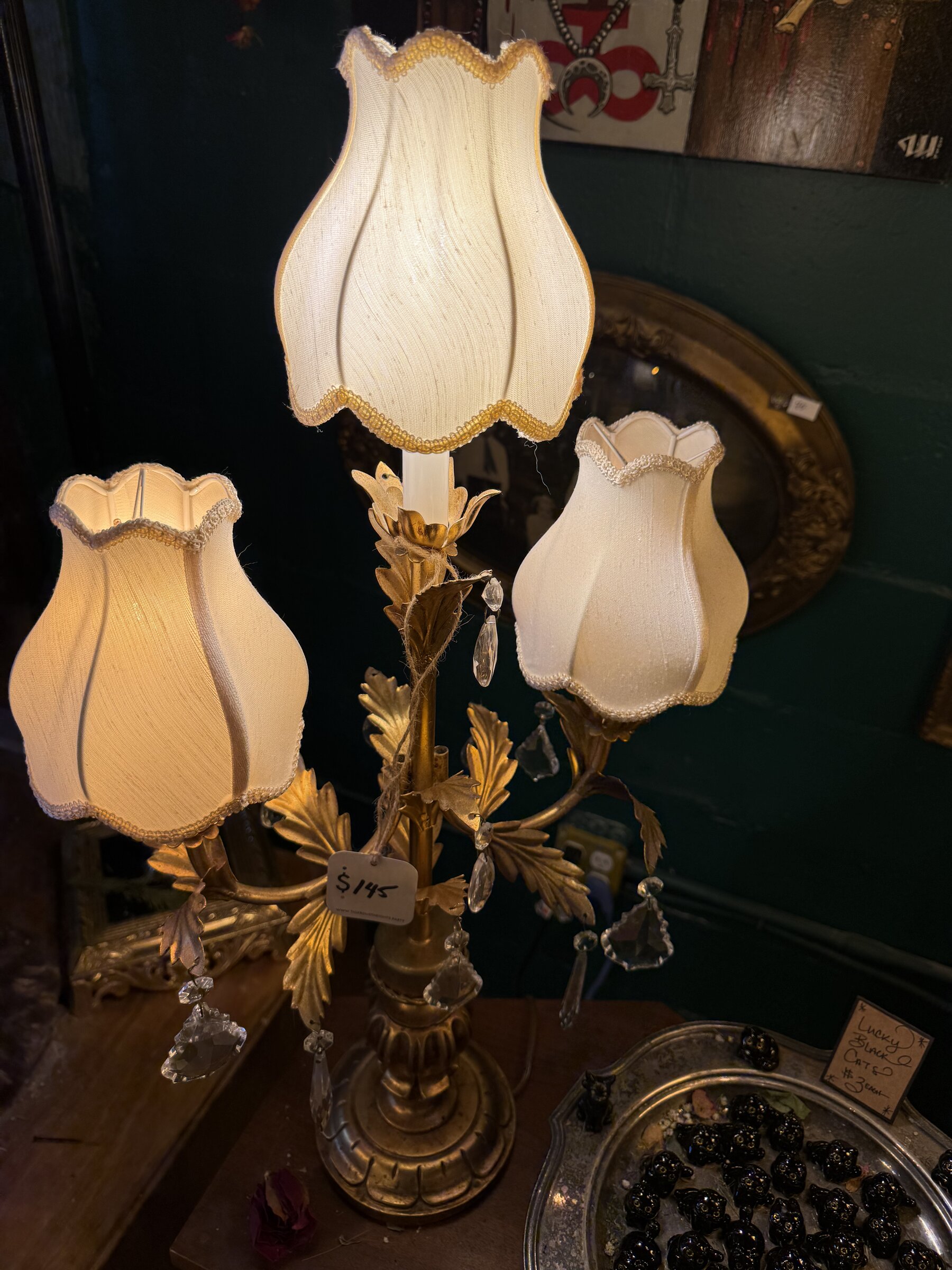 Two glass-shaded sconce lamps with crystal drops